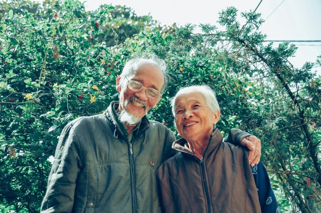 Smiling asian Man and Woman Wearing Jackets